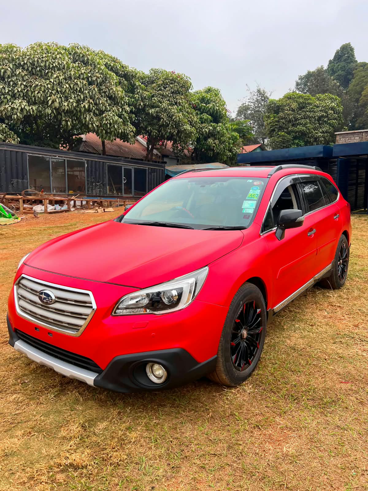 Subaru Outback after the satin red vehicle wrap